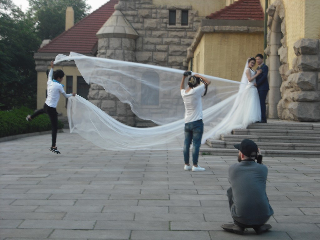 Another church, another wedding photo shoot.  They're really fun to watch.  Gotta jump high to get that train looking just right!