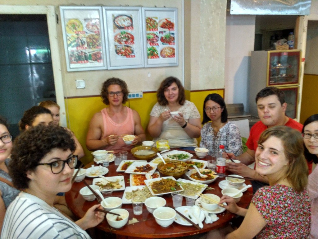 The new arrivals and our table heaped with Chinese food.  So many foreigners!  haha