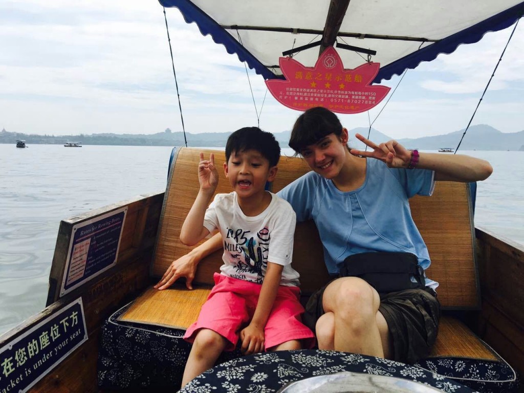 Boat ride on West Lake, splashing ourselves to stay cool.