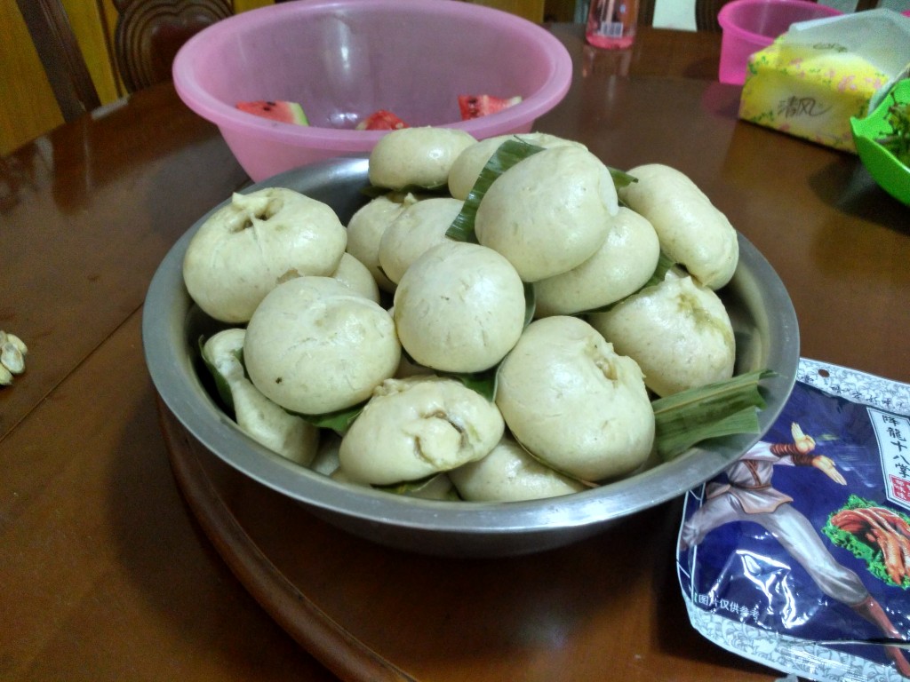 A heap of freshly steamed buns waiting to be eaten.