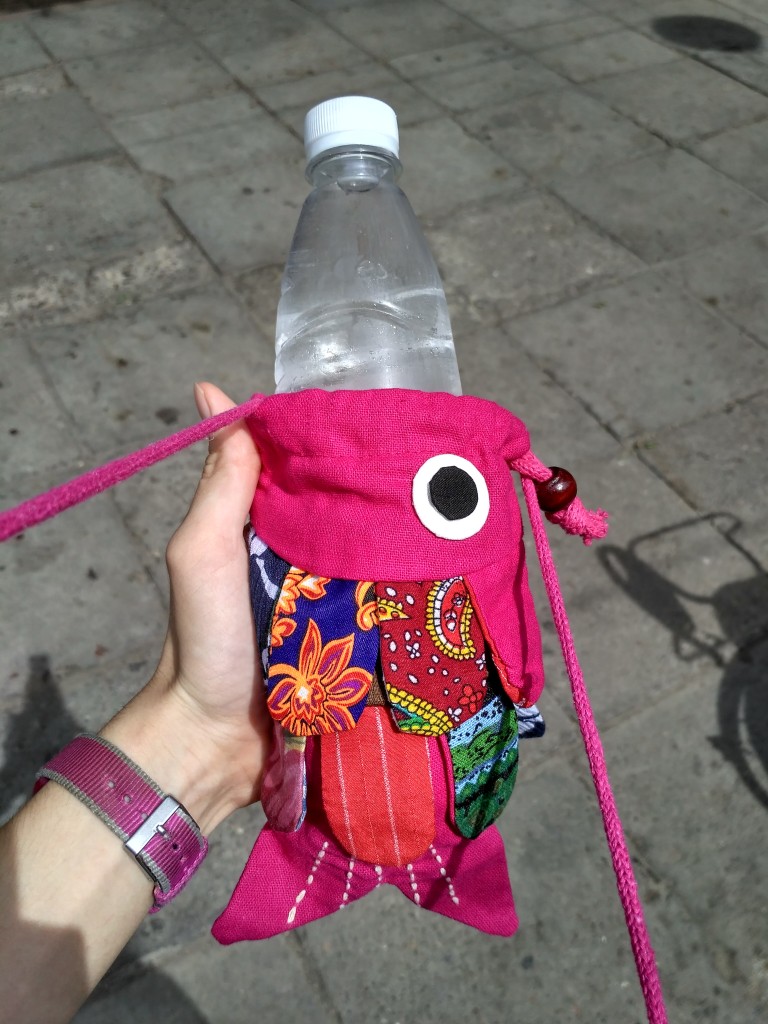 I impulse bought this fish purse... turns out he's the perfect shape for carrying my water bottle!