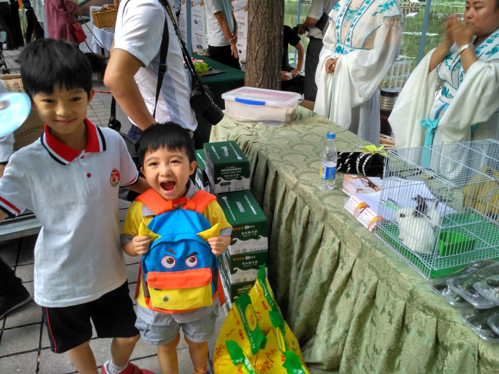 Mingming (left) and Lele (right) were excited to see the bunny rabbit at this event booth.