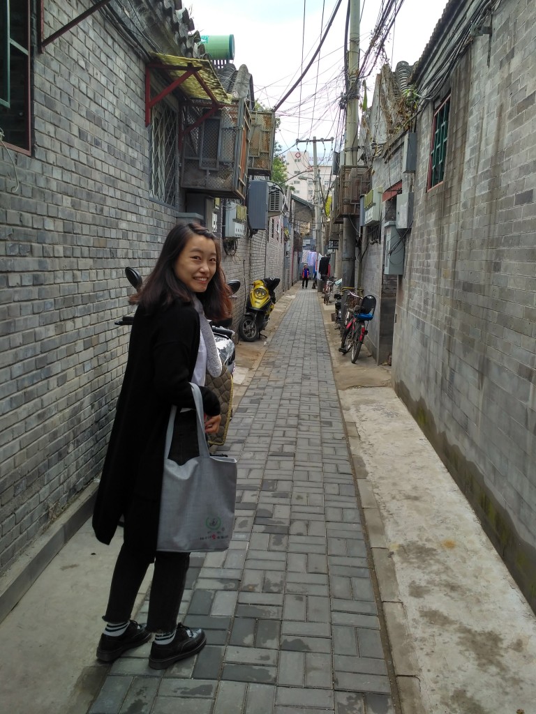 Exploring the Hutongs with Sylvia. The doorways to the left and right lead into the private courtyards of people's homes.