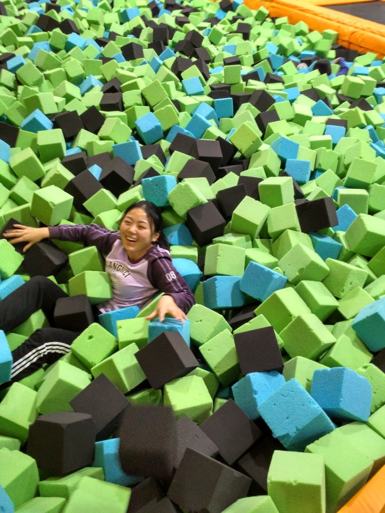 Kate got swallowed by the foam pit. There were trampoline spring pads on one end (great for practicing flips if you're afraid of falling on your head!) and a rock climbing wall on the other side (no harness needed).