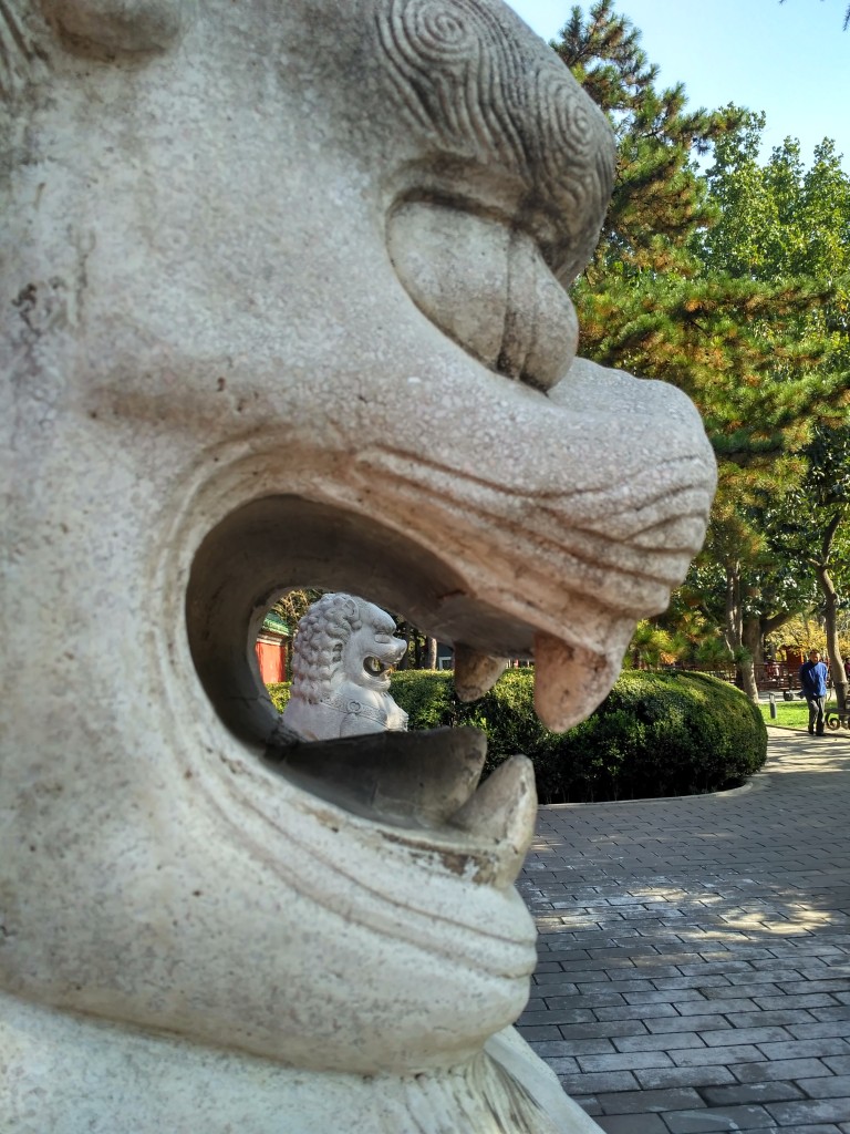 The doorway was closed off to visitors, but the stone lions guarding the gate offered an interesting photo perspective. How many lions do you see?