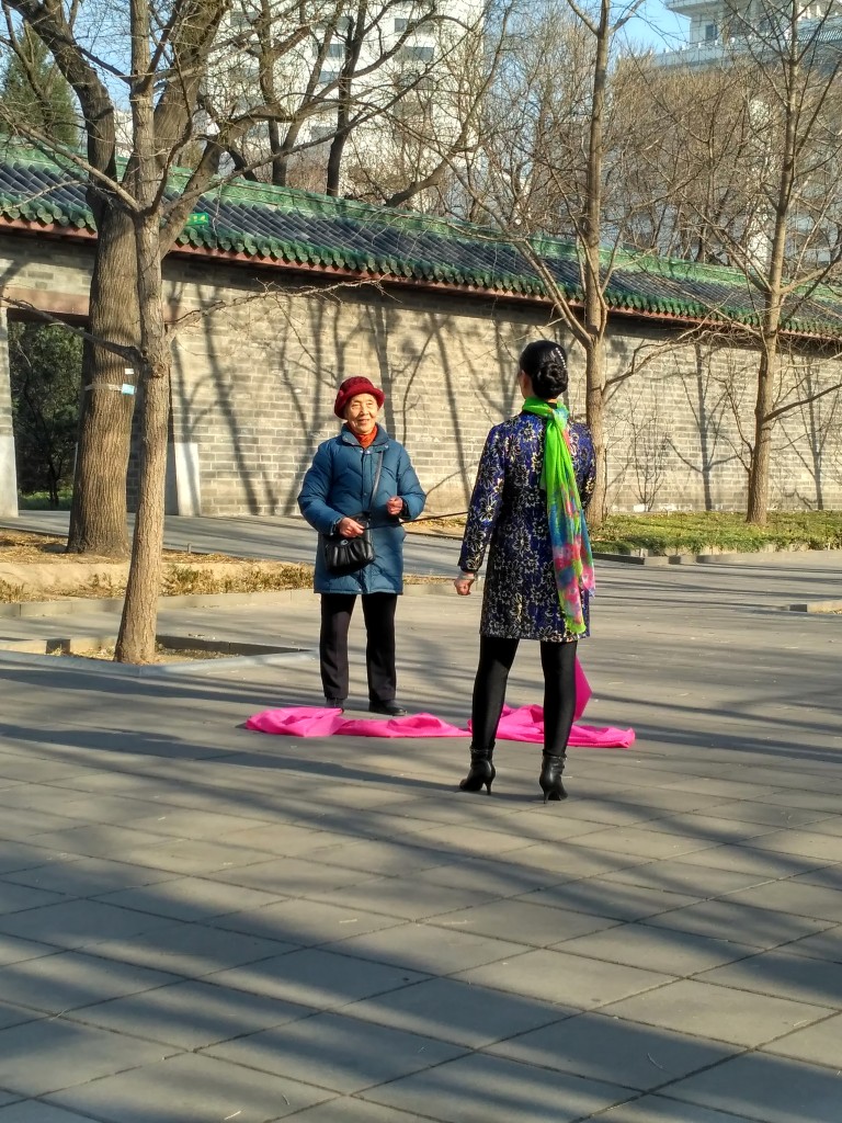 Old women giving this lady some pointers.